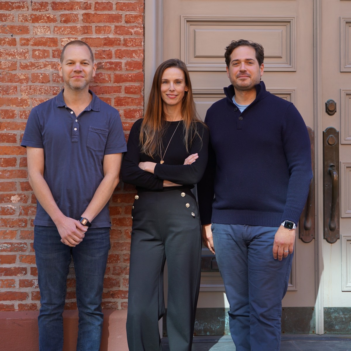 Fora Founders, Evan Frank, Henley Vazquez and Jake Peters leaning against building and smiling.