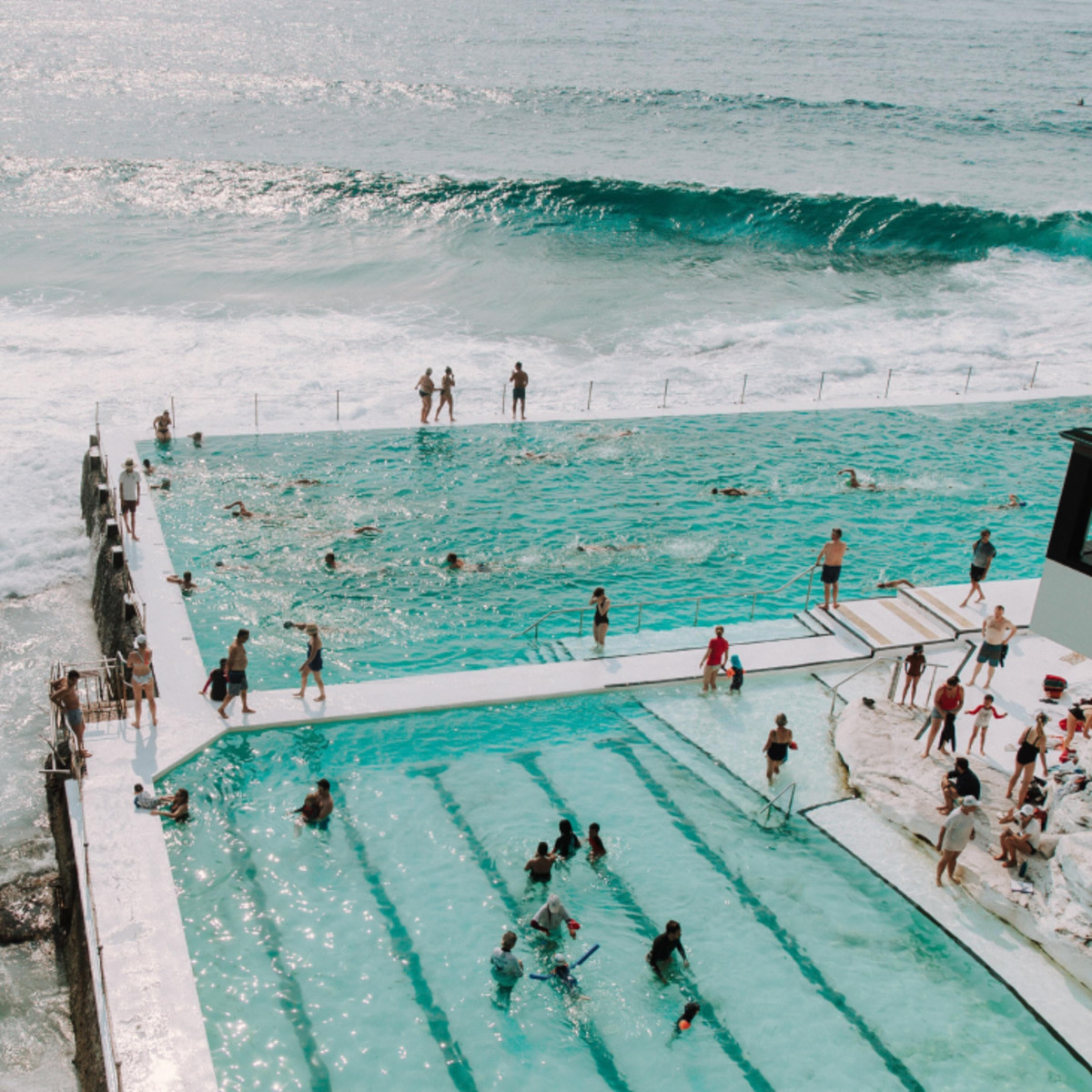 People in pool and ocean. 