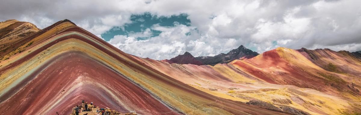 Rainbow Mountain in Cusco, Peru on a bright and cloudy day.